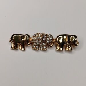 3 elephants in a line brooch one with rhinestones and the others gold